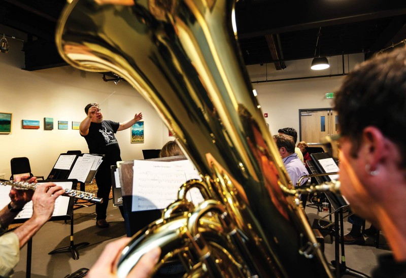 Portsmouth Music and Arts Center Executive Director Russ Grazier conducts the New Horizons Band in rehearsal. Photo by Cheryl Senter.