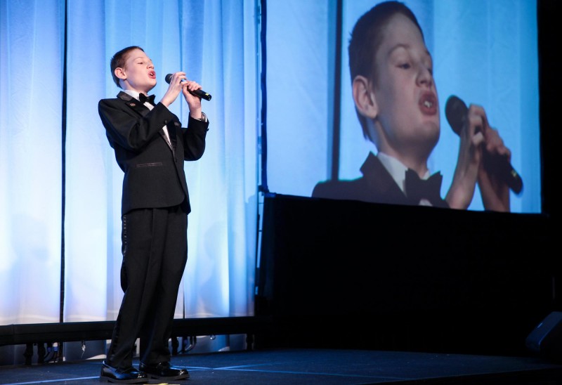 Christopher Duffley stepped up to the stage and sang “Lean On Me” at the Charitable Foundation’s Annual Meeting on June 12, 2014. Photo by Cheryl Senter.