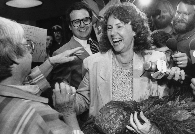 High school teacher Christa McAuliffe greets family and friends at Manchester Airport, July 20, 1985. McAuliffe was announced on Friday as the school teacher that would be the first citizen to go up in space aboard the Space Shuttle. (AP Photo/Jim Cole)