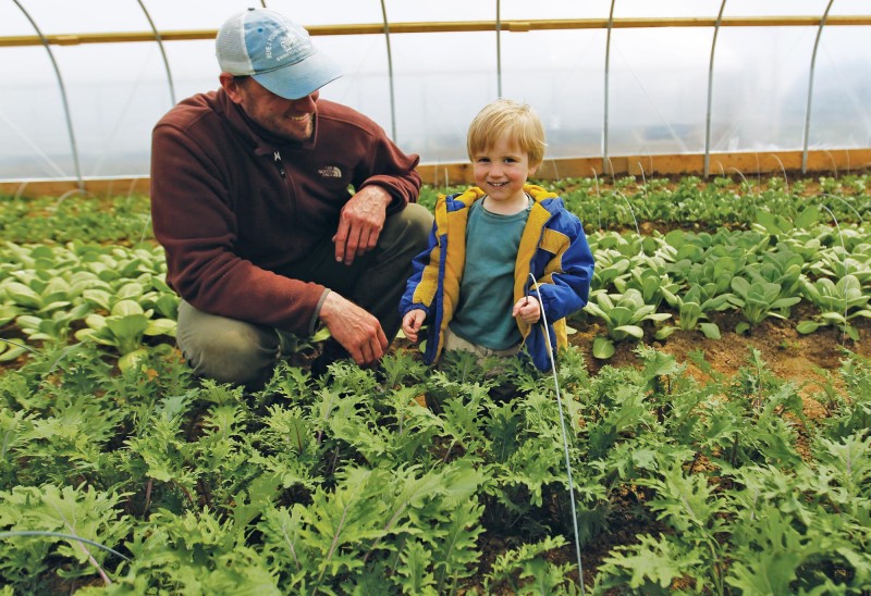 Luke Mahoney and his son at Brookford Farm in Canterbury, NH. Photo by Cheryl Senter.