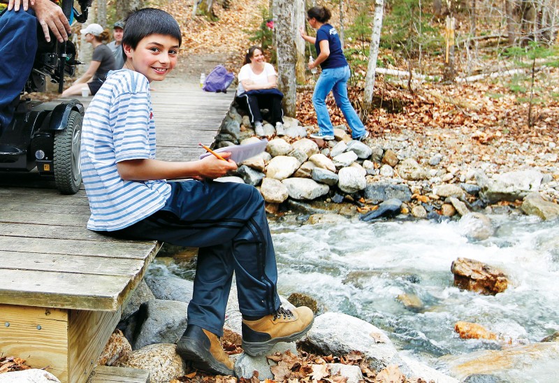 Paul Salek, a fifth-grader at Milan Village School, learns about watersheds at the Appalachian Mountain Club's Highland Center. Photo by Cheryl Senter.
