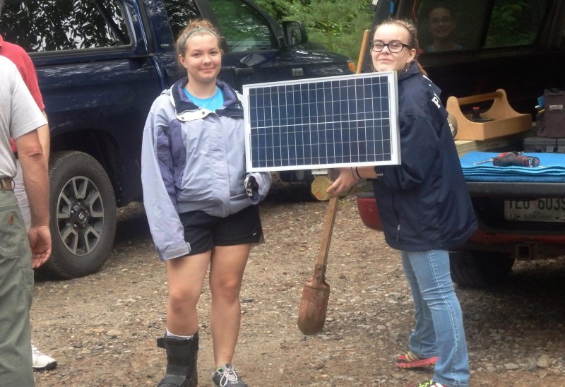 Girls from The Circle Program learn to install solar panels.