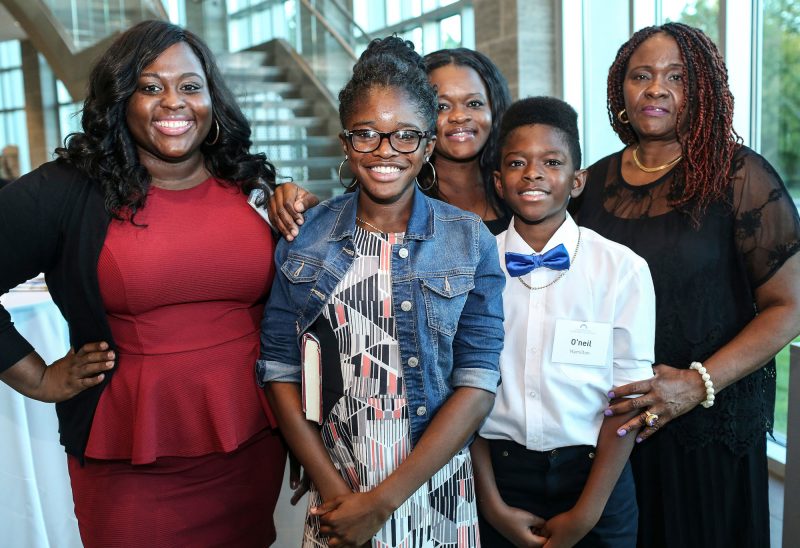 Alexandra Lominy (far left, pictured with members of her family) has her dream job as a registered nurse thanks to the Medallion Scholarship Fund. (Photo by Cheryl Senter).