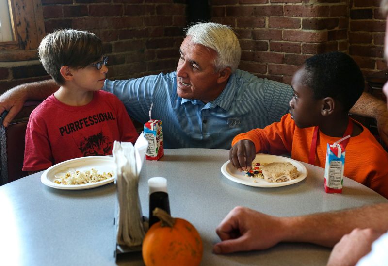 Gregg Burdett, CEO, Big Brothers Big Sisters of New Hampshire, with two "littles" at CCA Global. (Photo by Cheryl Senter).