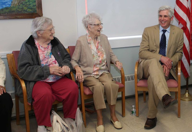 Craig Welch, executive director of the Portsmouth Housing Authority and the 2016 Caroline and Martin Gross Fellow, shares a laugh with PHA residents. (Photo by Cheryl Senter).