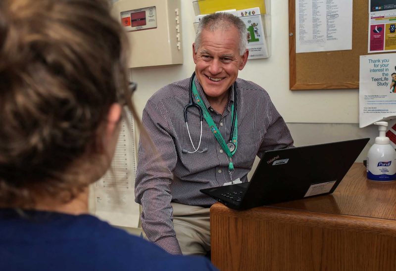 Dr. Steve Chapman of Dartmouth-Hitchcock Medical Center uses a customized screening, intervention and referral protocol to speak with young patients about substance use. (Photo by Cheryl Senter.)
