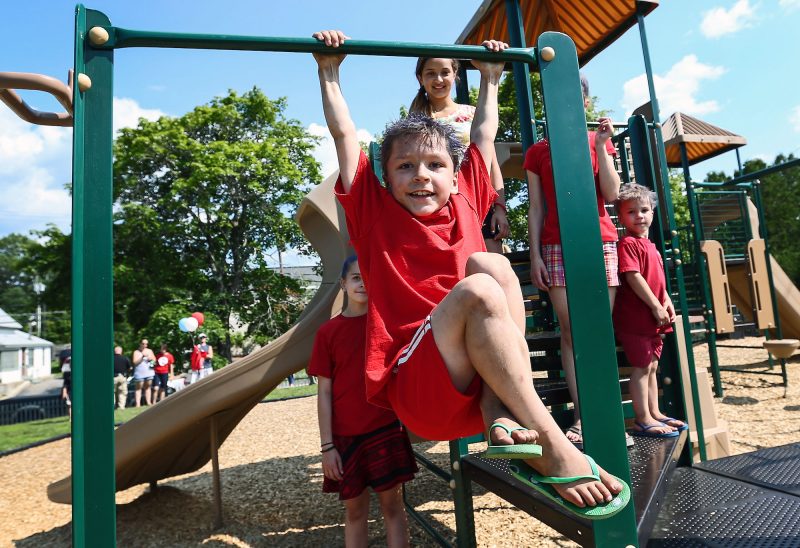 Kids playing on their new playground, thanks to the support of three donor-advised fundholders coming together to support the building costs of the new Pittsfield playground. (Photo by Cheryl Senter.)