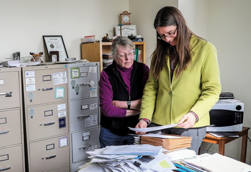 Attorney Ruth Heintz (right) and paralegal Dona Larsen cover the territory from Plymouth to the Canadian border. (Photo by Cheryl Senter.)