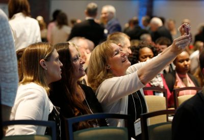 Annual Meeting guests taking photo