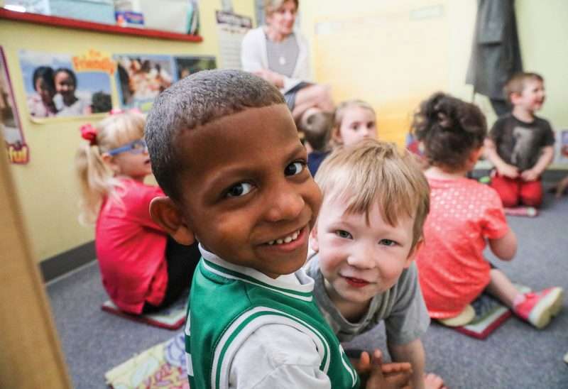 Kayson and Aidan participate in circle time at Laconia Early Learning Center, a program of Lakes Region Child Care Services. (Photo by Cheryl Senter.)