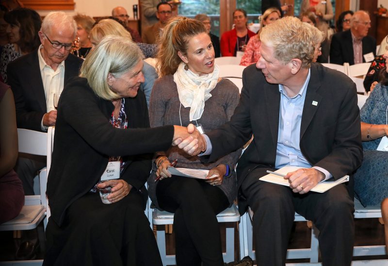 The Grapevine Family and Community Resource Center's executive director, Melissa Gallagher (center), and family support director & parenting facilitator, Carol Lunan (left), speaking with Dick Ober, Foundation president and CEO. (Photo by Cheryl Senter.)