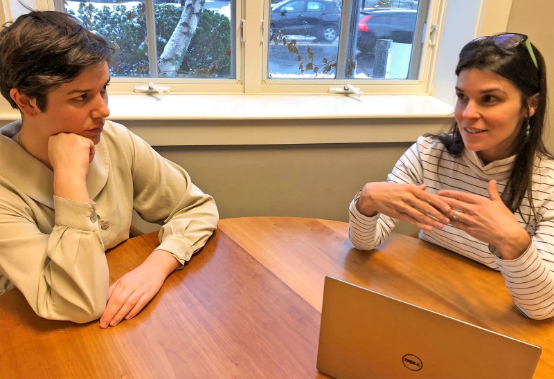 Foundation senior program officer for the Upper Valley Traci Fowler (right), talking with Jessica Kierstead, student aid officer about the Youth Risk Behavioral Survey (YRBS) findings.