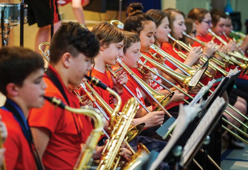 The Laconia Middle School Band plays for local elementary school students. (Courtesy photo.)