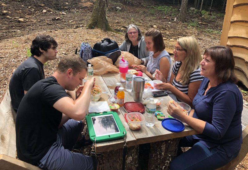 Greengard Center for Autism staff enjoying lunch with participants at Graylag Cabins. (Courtesy photo.)