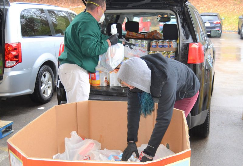 Volunteers supporting the New Hampshire Food Bank through a food drive. (Courtesy photo.)