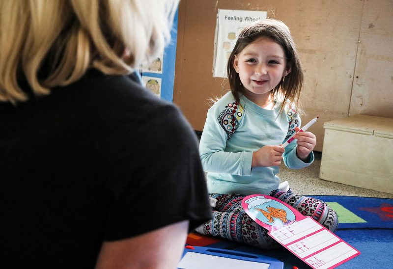 Teacher Martha Sharp works with child at Easterseals Child Development Center in Manchester. (Photo by Cheryl Senter.)