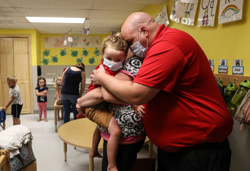 Devon, Morgan and Rawson Phillips embrace at Country Day School in Colebrook. (Photo by Cheryl Senter.)