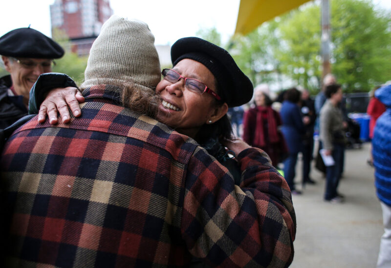 People attended a rally in May 2017 for immigrant and refugee justice in Veterans Park in downtown Manchester. (Photo by Cheryl Senter.)