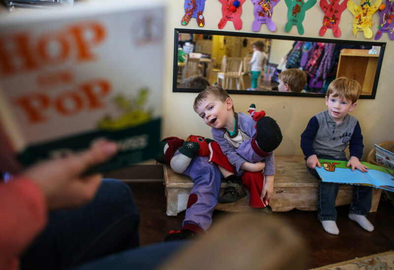 Students of the Barrington Village Enrichment Center gather for story time. (Photo by Cheryl Senter.)