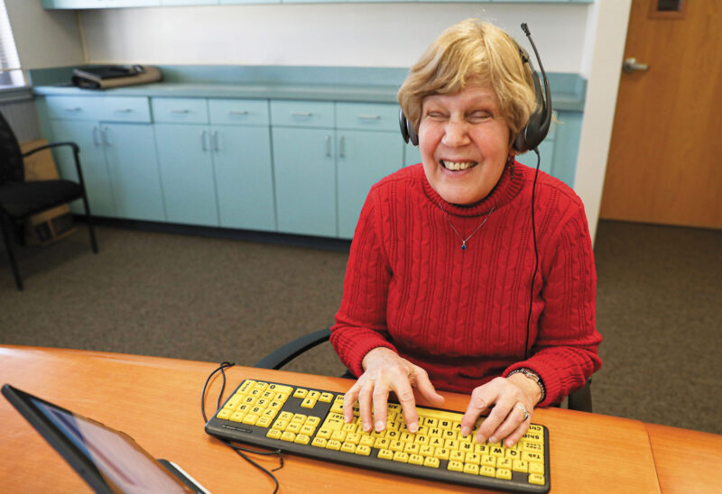 Jean Shiner demonstrating the "One4All" voting system at Future in Sight's Concord office. (Photo by Cheryl Senter.)