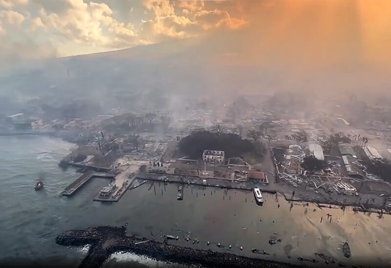 An aerial view shows damage along the coast of Lahaina in the aftermath of wildfires in Maui, Hawaii, on August 9, 2023 in this screenscot obtained from social media video. (Photo courtesy of Richard Olsten/Air Maui Helicopters/Reuters.)