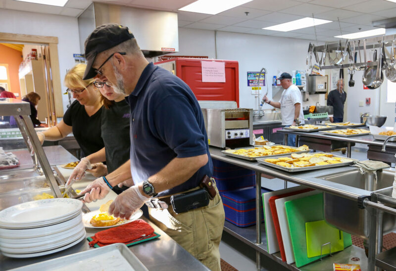 Associated Grocers of New England staff volunteer at Concord’s Friendly Kitchen on a Saturday morning. (Photo by Cheryl Senter.)